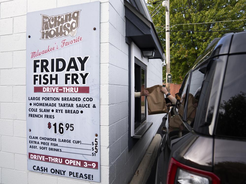 Kim Peot works the drive-through fish fry window.