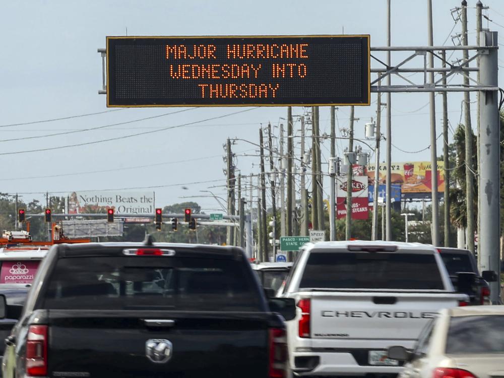 Highway signage announces the impending arrival of Hurricane Milton and the evacuation zones on Tuesday in Port Richey, Fla.