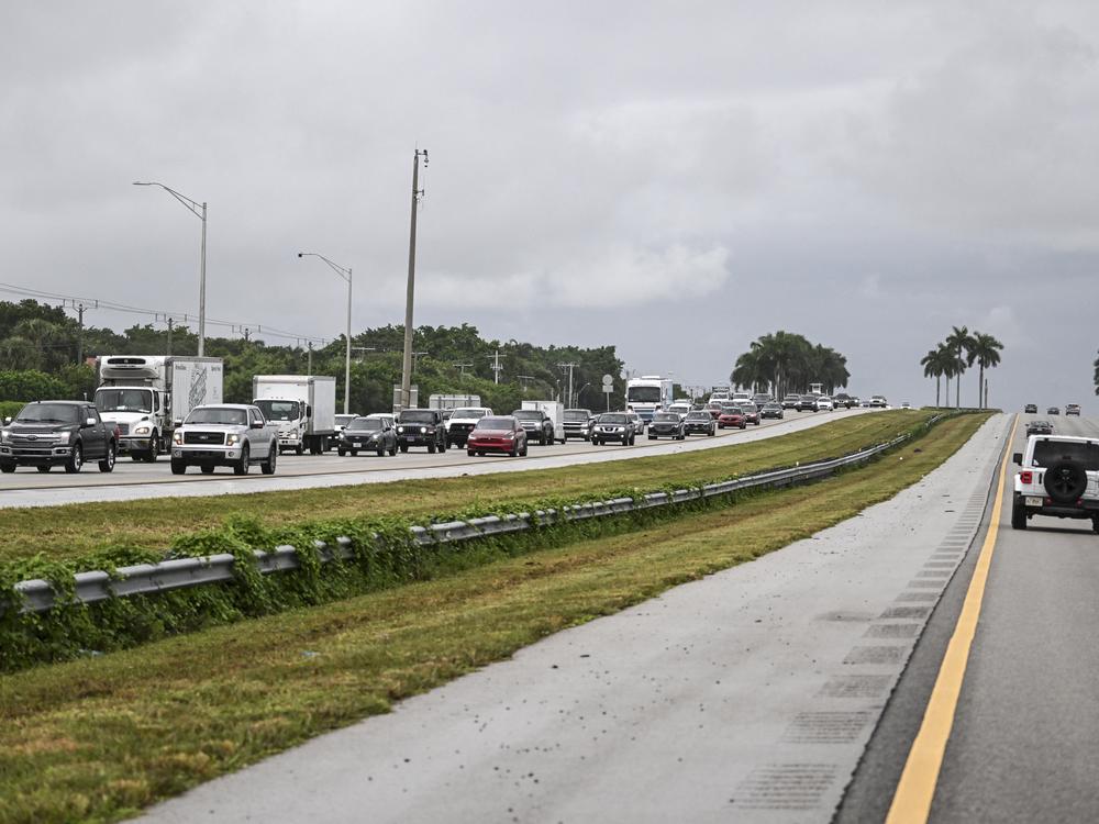 Cars drive east out of Naples, Fla., toward Miami on Tuesday as Hurricane Milton approaches.