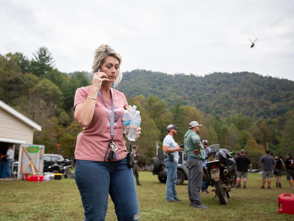 Misty Hughes, a fifth-generation resident of Poplar, N.C., organizes flood relief efforts at the Poplar Community Center on Friday. The mountain hamlet sits along the Nolichucky River, which rose to record levels of flooding from Tropical Storm Helene.