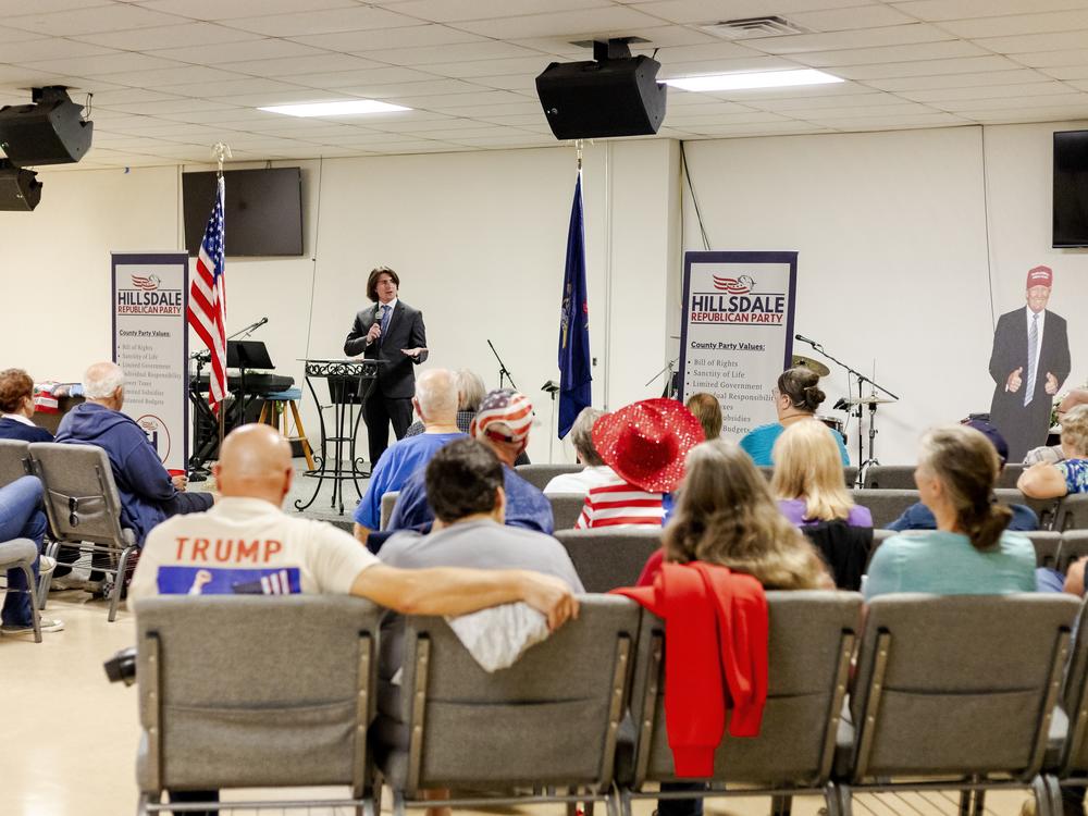 Carter Chain, a Regional Director for Election integrity for the Trump campaign speaks at an America First Republicans meeting encouraging people to be poll watchers in larger cities in Michigan on Election Day on Oct. 3 in Hillsdale, Mich.