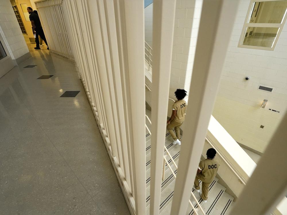 Inmates at the Cook County, Ill., jail head to a staging area at the jail's Division 11 law library before registering and voting in the local election in 2023 in Chicago.