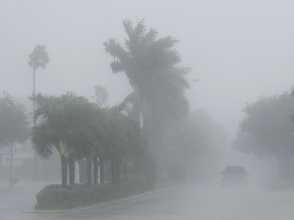 A Lee County Sheriff's officer patrols the streets of Cape Coral, Fla., as heavy rain falls ahead of Hurricane Milton on Wednesday.