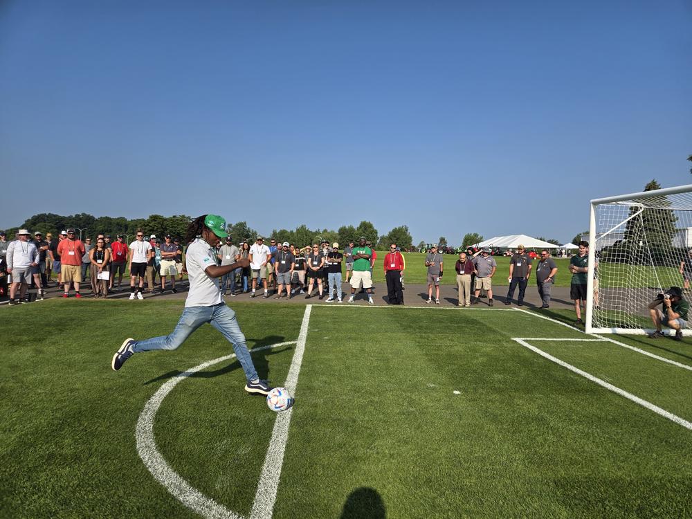 In August 2024, Michigan State University researchers give people a chance to try out shooting soccer balls on a field with different modifications during 2024 Turfgrass Field Day<br>