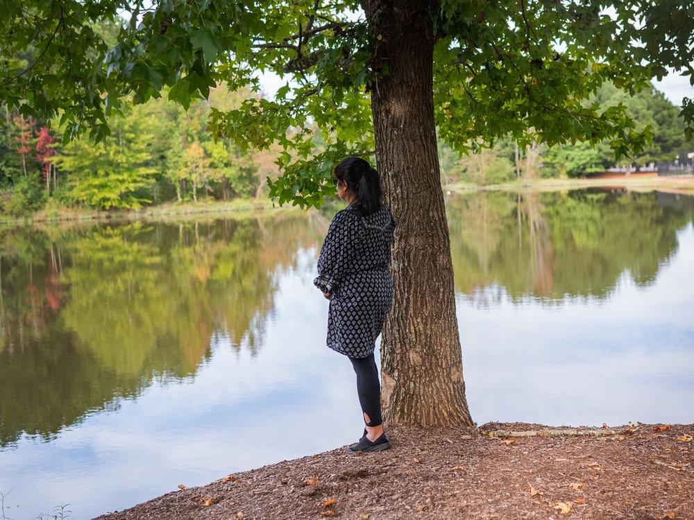 Farhana Rahman stands for a portrait in Johns Creek, Ga. on October 4, 2024. She asked that her face not be visible because she fears attacks based on her faith.