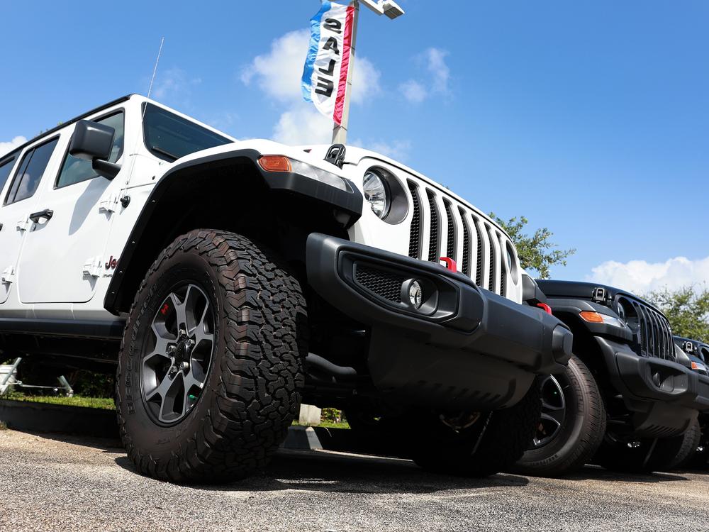 New Jeeps sit on a Dodge-Chrysler-Jeep-Ram dealership's lot on October 3, 2023, in Miami, Fla. Stellantis, which owns all four American brands, has been struggling financially.