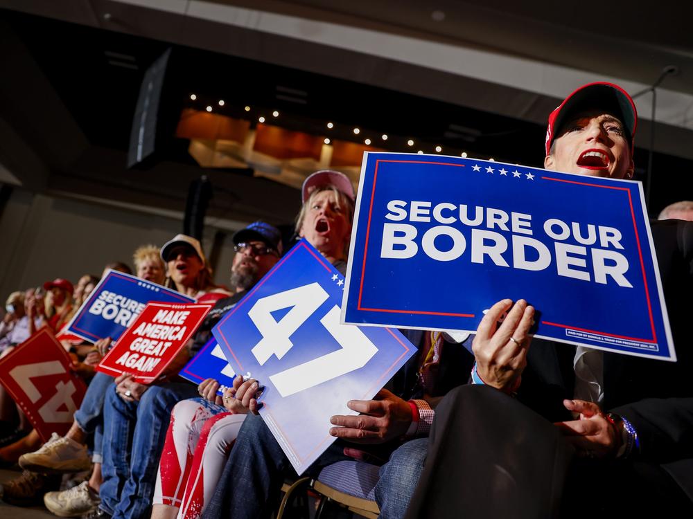 People cheer ahead of Trump's rally in Aurora, Colo.