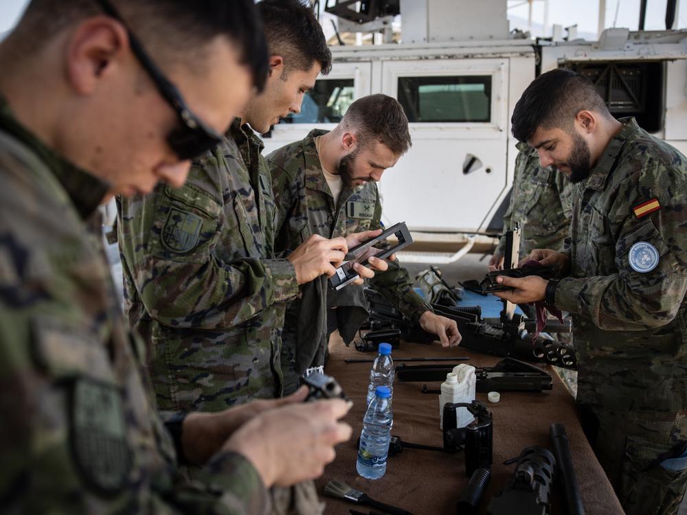 U.N. peacekeepers from a Spanish brigade of the United Nations Interim Force in Lebanon (UNIFIL) clean their weapons at their base close to the Blue Line in August in Kafarkila, Lebanon.