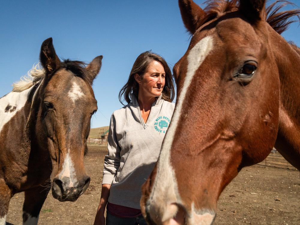 Hilary Zaranek with her horses at one of her family's ranches near Melville, Mont.