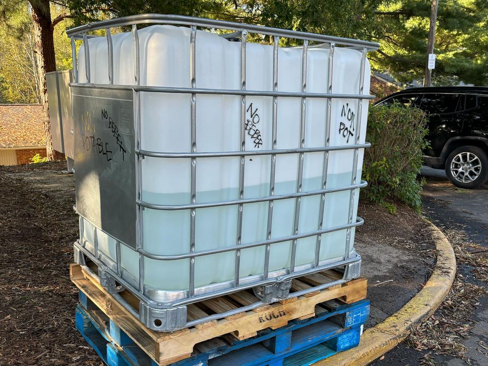 A large plastic containers that can hold at least 250 gallons of water to flush toilets.