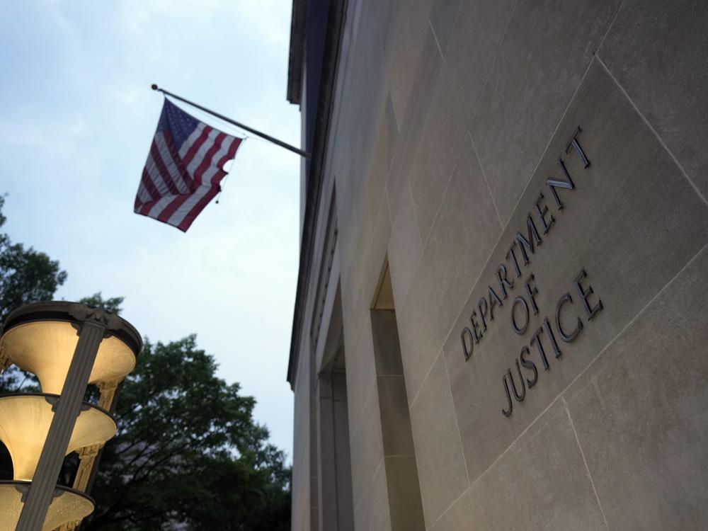 The Department of Justice is photographed on June 8, 2023. The department has brought a suit against Virginia election officials that accuses the state of striking names from voter rolls in violation of U.S. law.