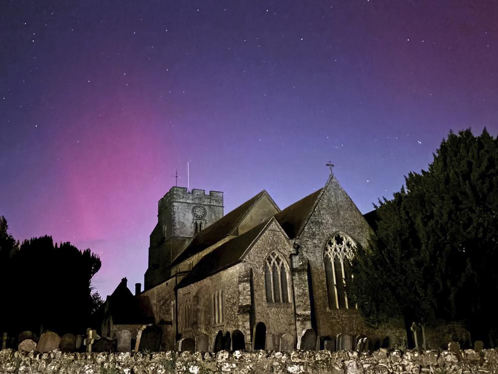 Northern lights on display in the skies over Great Chart Church, Ashford, Kent, England, on Oct. 10.