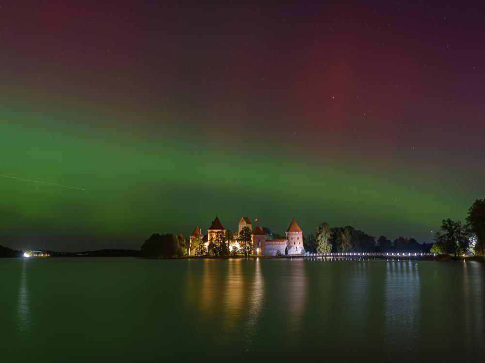 Northern lights shine in the night sky above Trakai castle, about 18 miles from Vilnius, Lithuania, on Oct. 10.