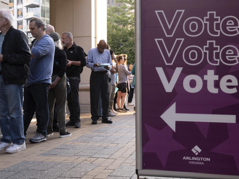 Voters line up to cast their ballot as early voting starts in Arlington, Va., on Sept. 20, 2024.
