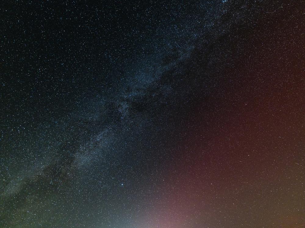 The Milky Way and northern lights are seen together as the aurora makes a rare appearance in the early morning hours of Oct. 8, southwest of Mammoth Lakes, California.