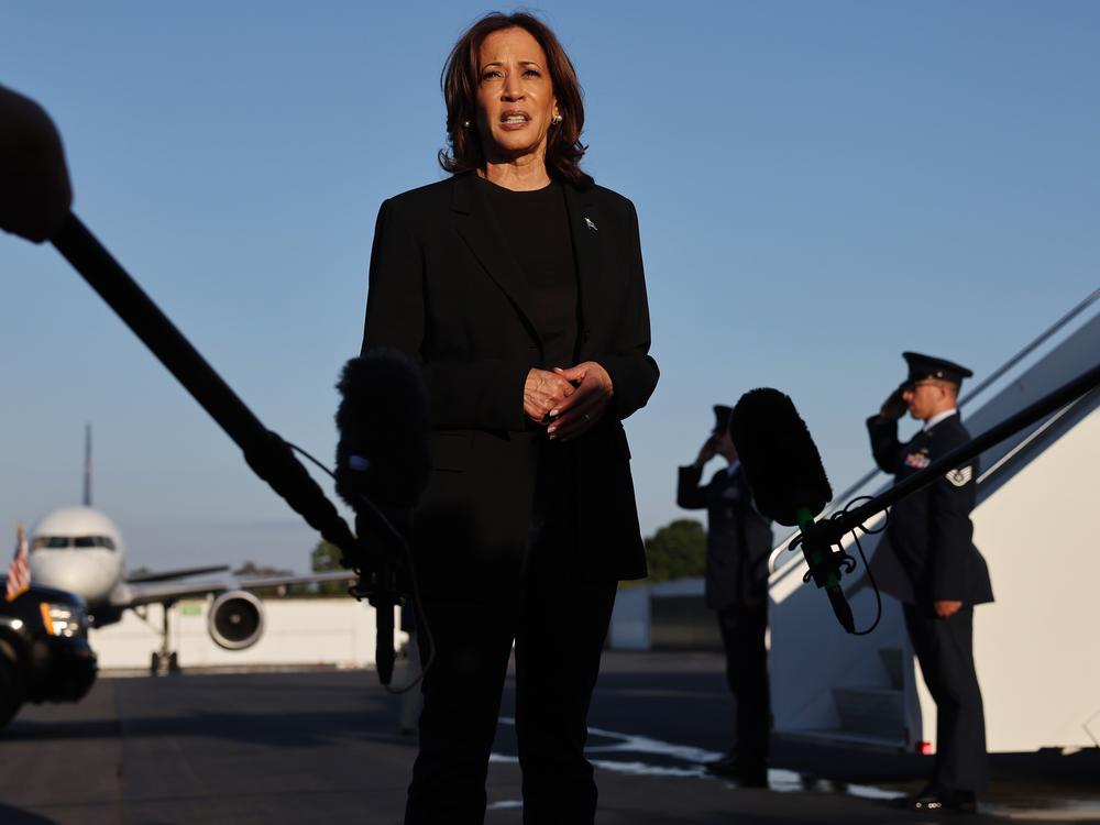 Vice President Harris speaks to the media before boarding Air Force Two after assessing the Hurricane Helene recovery response in North Carolina on Oct. 5. Some political pundits have described the storm as an October surprise.