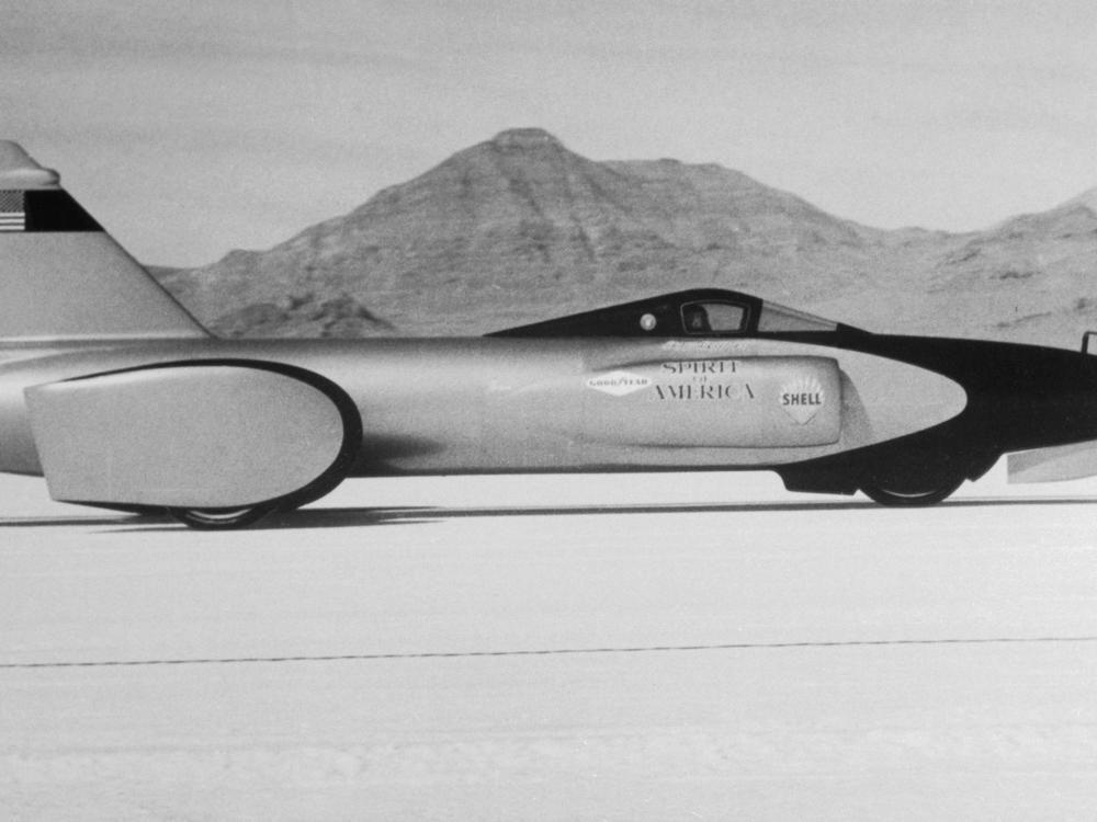 The jet-powered 'Spirit of America,' with Craig Breedlove at the wheel, on the Bonneville Salt Flats. The three-wheeled racer was powered by a J47 engine — the same type used in an F104 jet fighter plane.