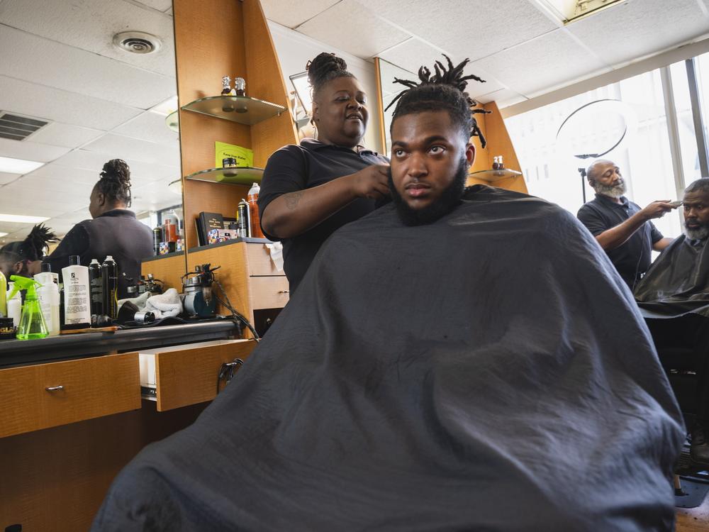 Cherita Evans aka Storm the Barber, with Christian Pounds in her chair at Head Changerz Barber Lounge in Rocky Mount, N.C. on May 23, 2024.