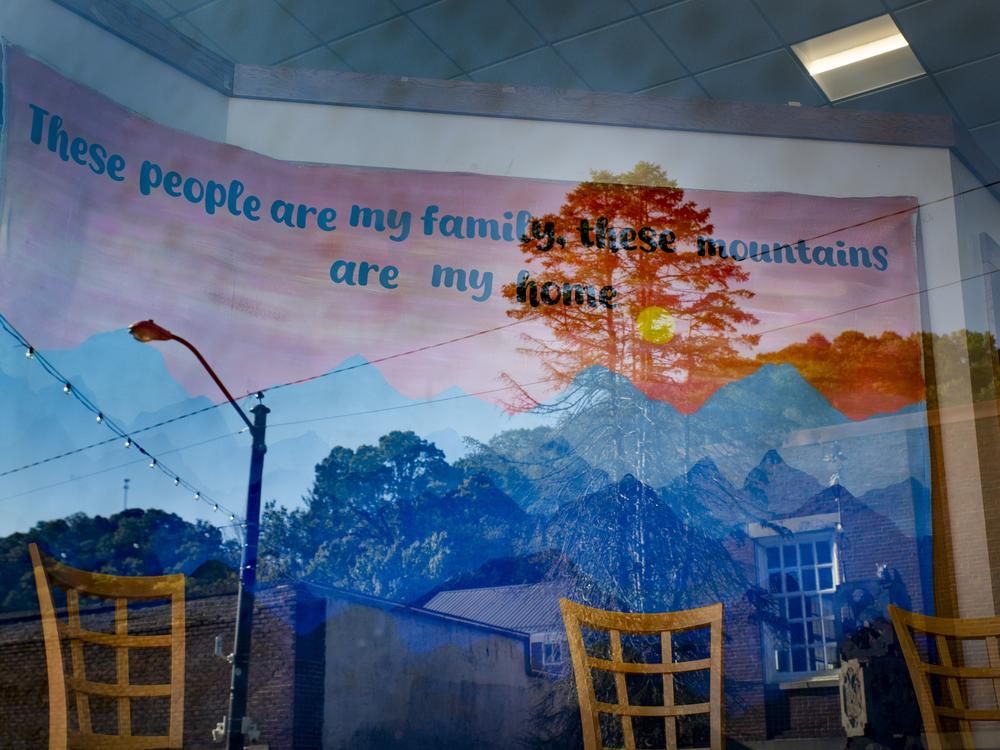 A mural inside the Letcher County Public Library in Whitesburg, Ky., reads, “These people are my family, this mountains are my home.”
