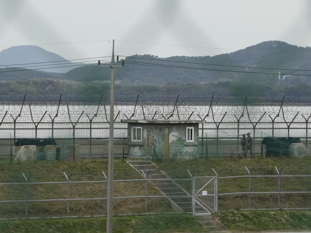 South Korean army soldiers patrol along the barbed-wire fence in Paju, South Korea, near the border with North Korea, Monday.