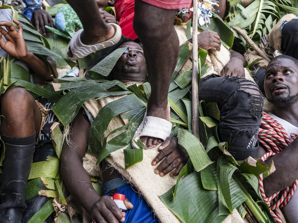 People carry religious representations while walking on the Manacillos on March 31, 2024, in the town of Juntas, Buenaventura, Colombia.