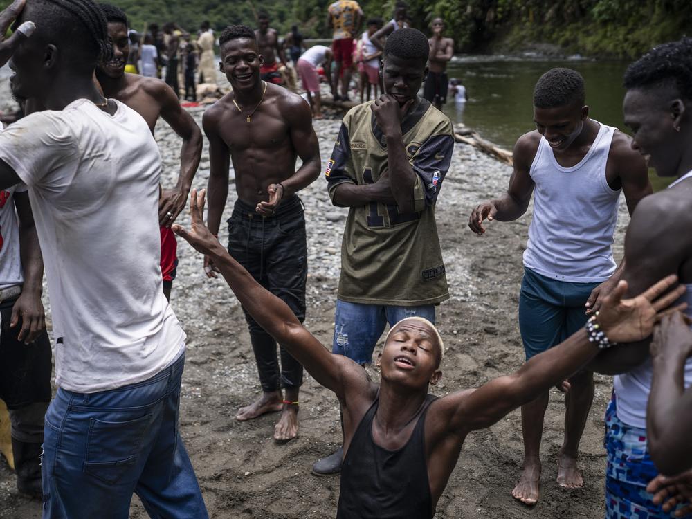 The community gathers at the river on the last on the last day of Holy Week on March 31, 2024, in the town of Juntas, Buenaventura, Colombia.