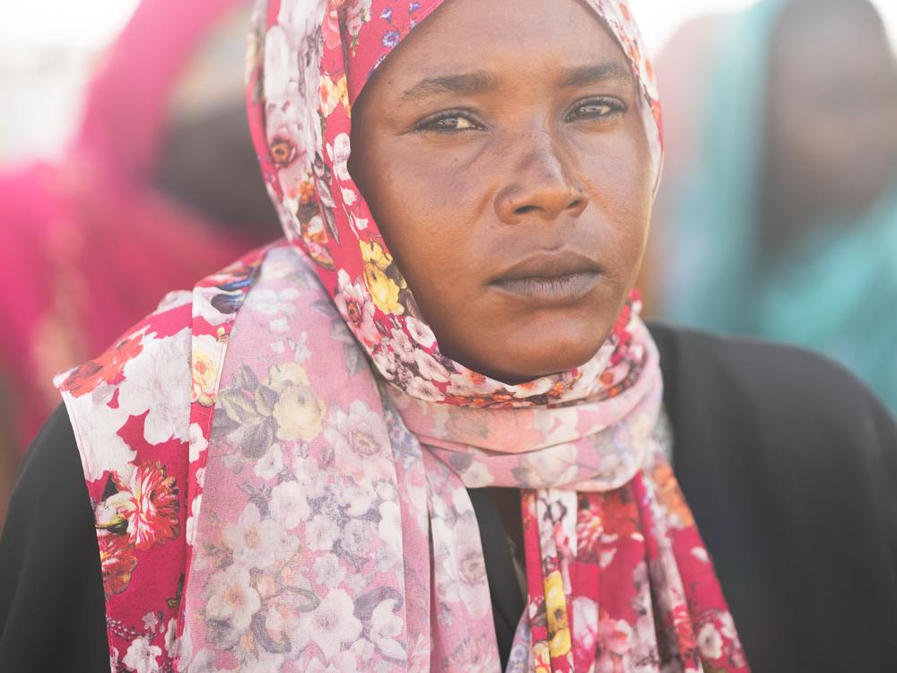Naima Usman Omar, 22, a Sudanese refugee, lost her father and two brothers; they were killed in a bombing in Al Fashir,  a city in the North Darfur region under siege by the RSF. She arrived in Chad on September 21, the day this photo was taken.<br>