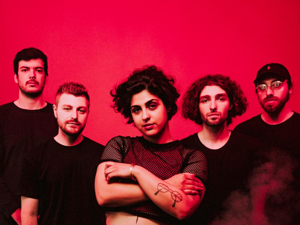 Zayna Youssef (center) with her Sweet Pill bandmates.