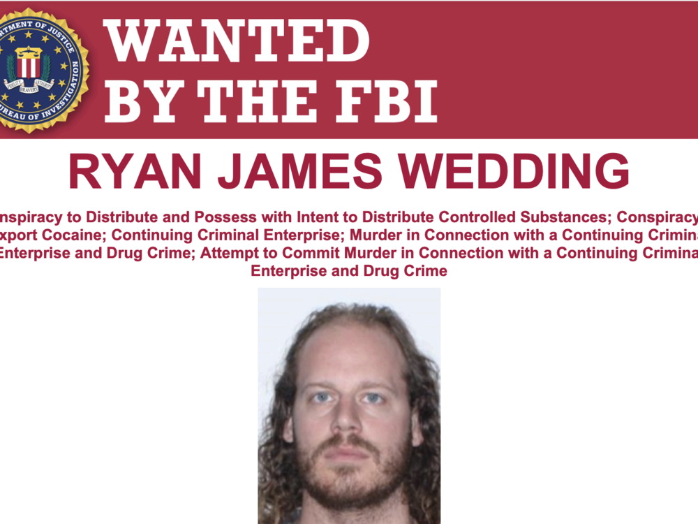 Ryan Wedding appears on an FBI wanted poster. The U.S. says Wedding, 43, is a fugitive and may be in Mexico.
