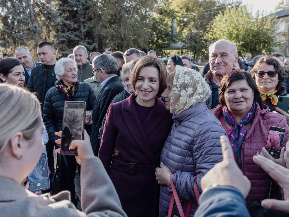Moldova’s President Maia Sandu poses for a photo with supporters during a campaign event in Telenești, Moldova, October 18, 2024.