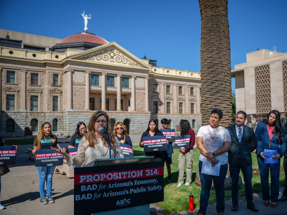Monica Villalobos joined elected officials, business leaders and educators to speak in opposition to Proposition 314 in Phoenix on Oct. 10, 2024. The ballot measure would require police to perform immigration duties in addition to their regular enforcement duties.
