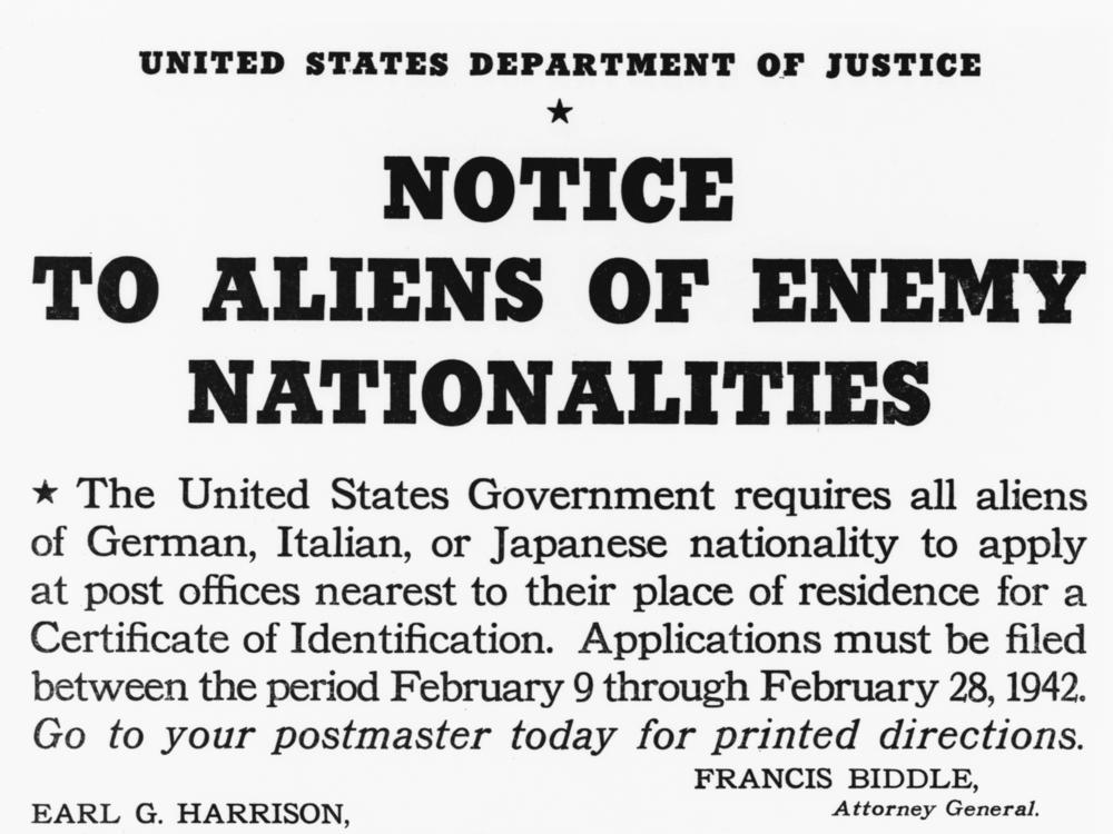 A 1942 poster notifies U.S. residents of Japanese, German and Italian nationality to apply at their nearest post office for a certificate of registration.