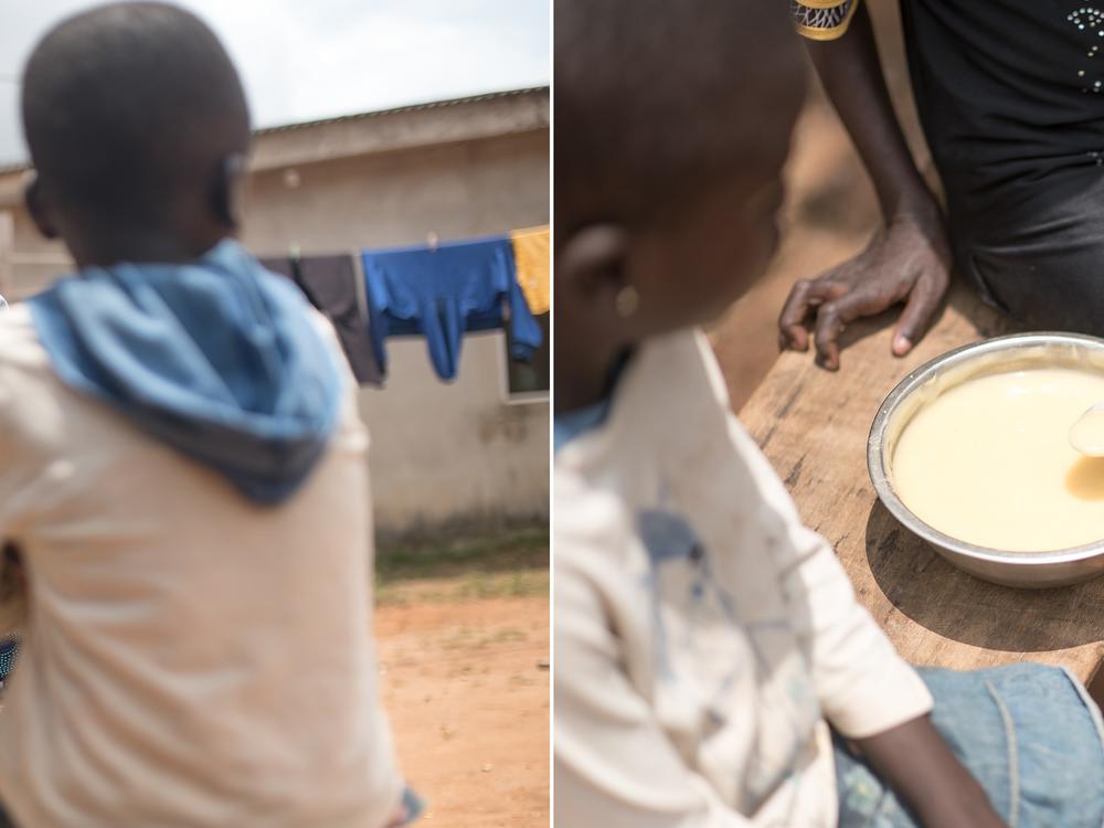 Saheed Salami serves pap to two of his four children for a meal.
