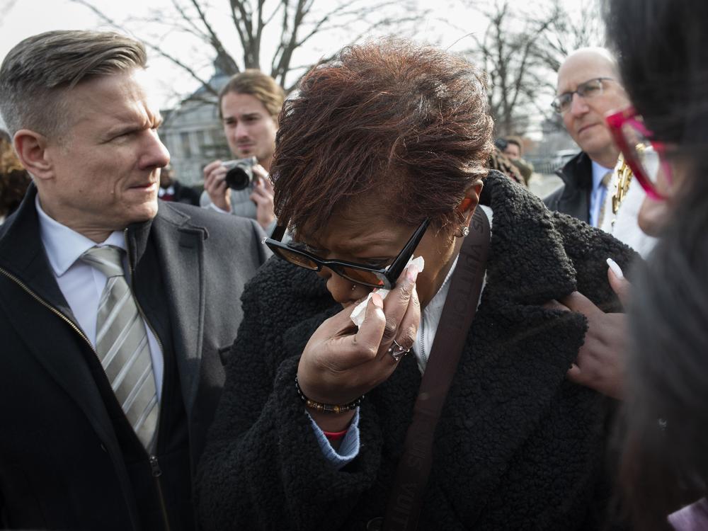 Pamela Walker, mother of Jayland Walker, who was shot and killed by police in Akron, Ohio, is comforted prior to appearing before reporters about police reform, on Capitol Hill in Washington, on Feb. 7, 2023.