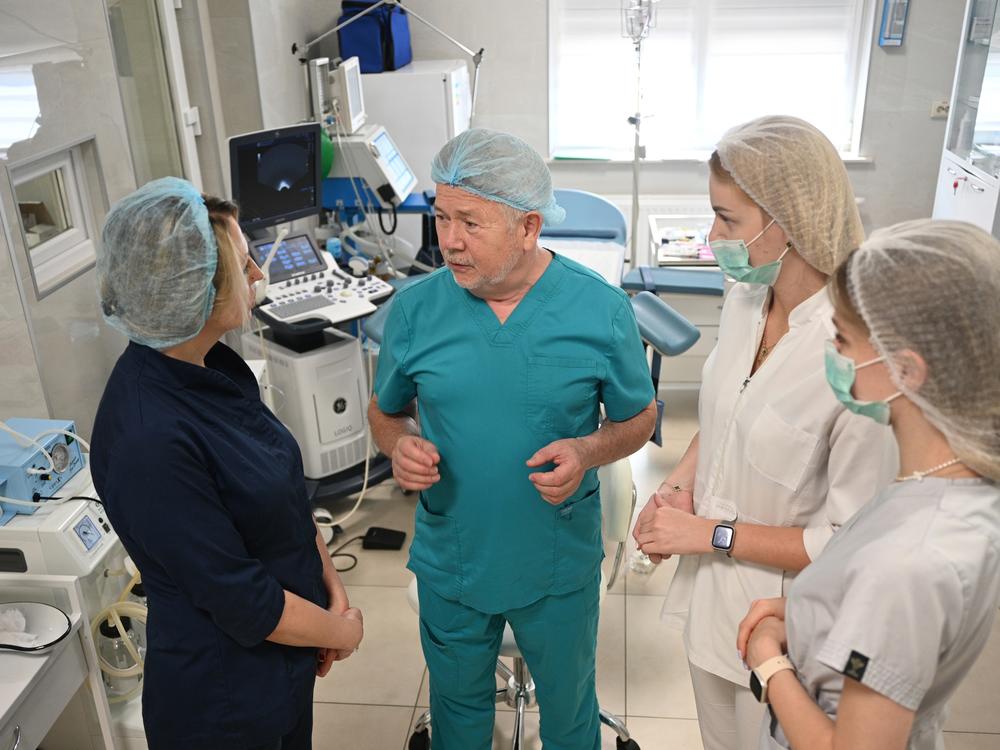 Dr. Stefan Khmil communicates with medical personnel in his medical center in Lviv, Ukraine, on July 12.