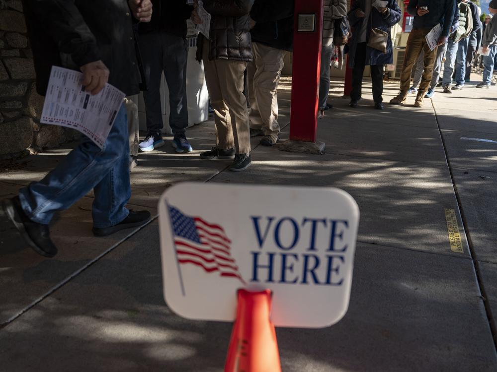 People wait in line to cast ballots during early voting at a polling station in Black Mountain, North Carolina, on Friday.