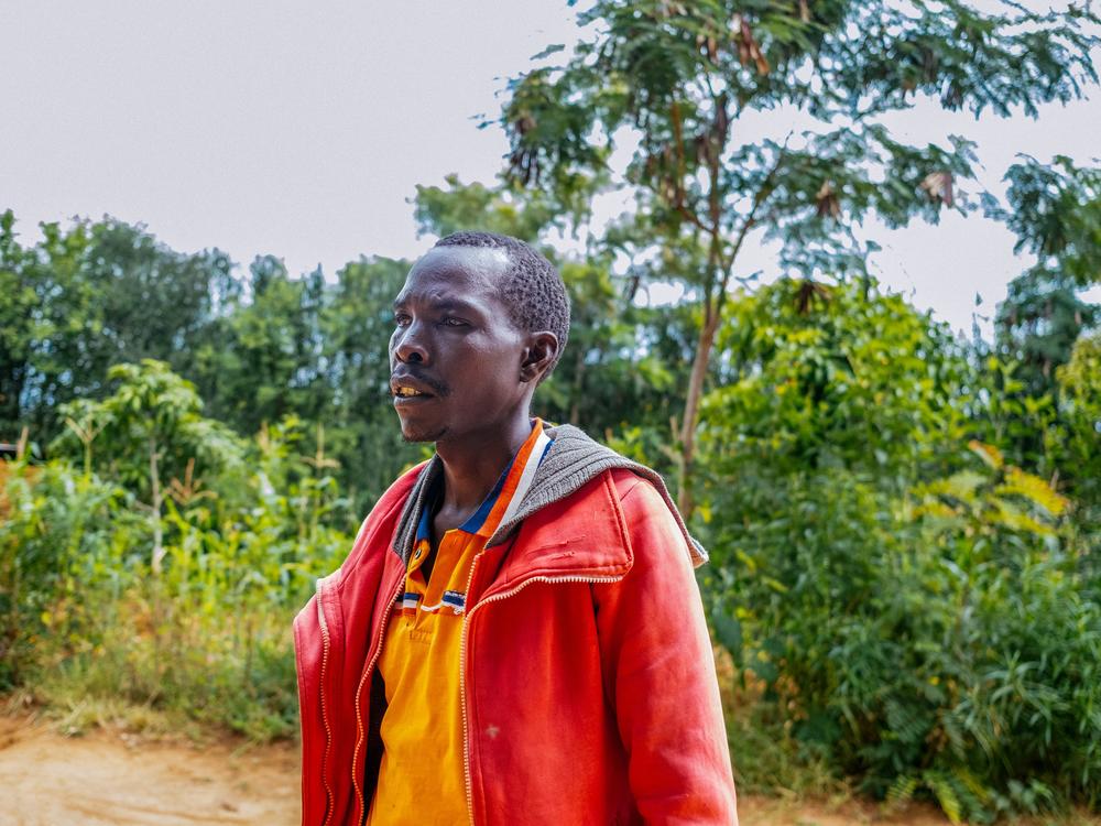 Stephen Nzioka at his farm. A weekly weather forecast sent to his phone has enabled him to plant and plan better, upping his income. That's been a boon for his daughters. 