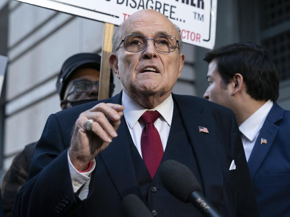 Rudy Giuliani speaks during a news conference outside federal court in Washington, Dec. 15, 2023.
