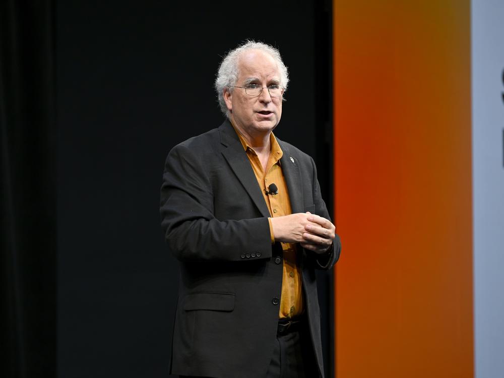 Internet Archive founder Brewster Kahle speaks onstage in 2022 in New York City. He said a cyberattack on the nonprofit, which advocates for universal access to all knowledge, affected more than 31 million of its users.