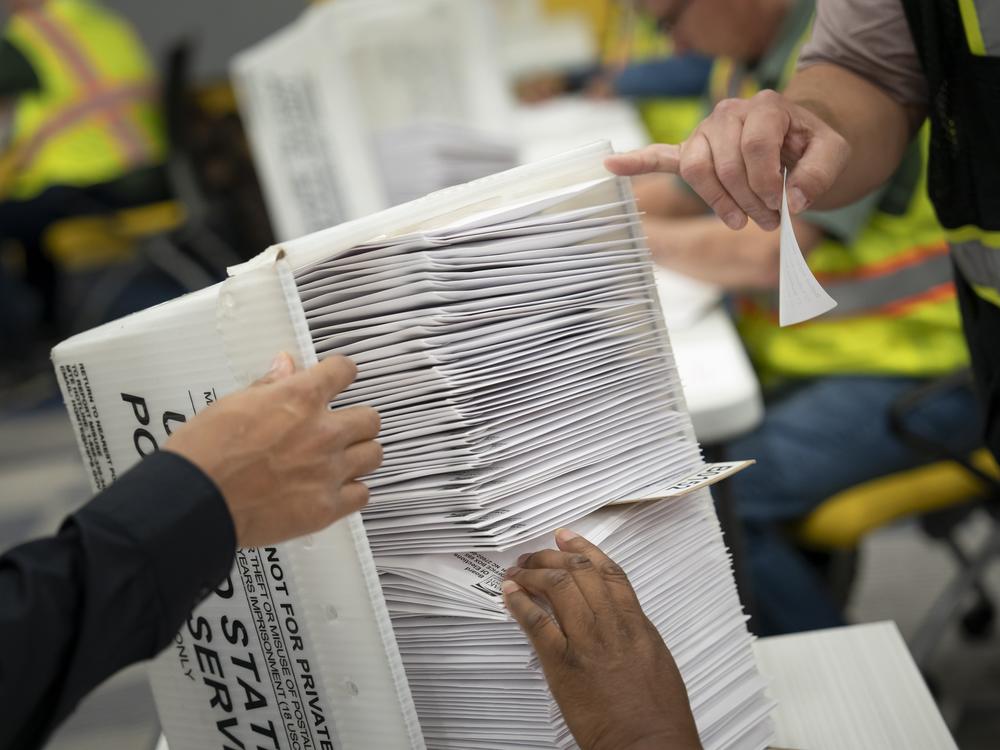 Workers at the Wake County Board of Elections prepare to mail absentee ballots in September in Raleigh, N.C.