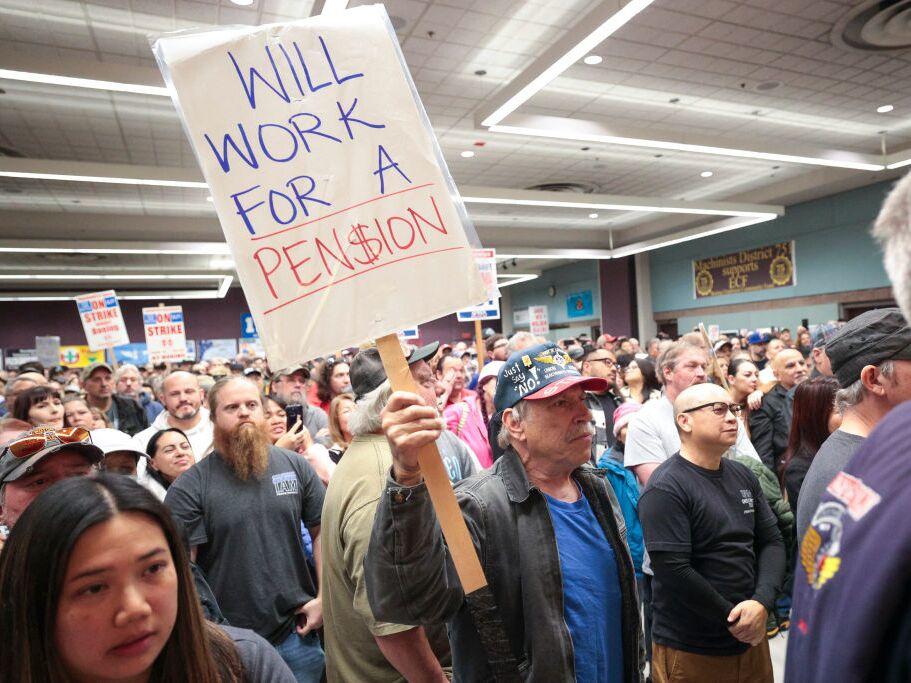 Terry Muriekes, a tool-storage worker at Boeing's factory in Everett, Wash. for 38 years, holds a sign during a strike rally last week.
