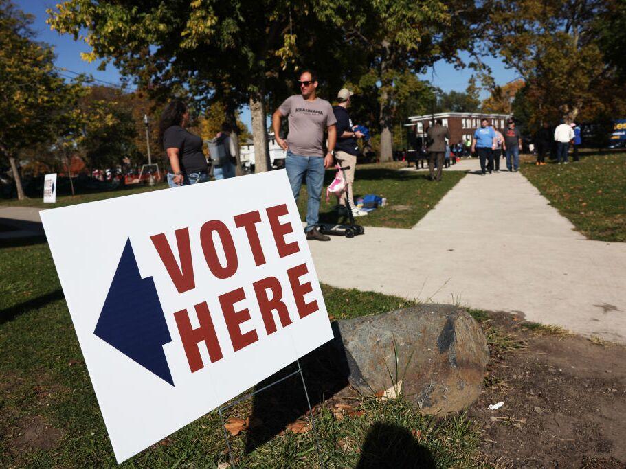 Residents vote in early voting at a park building in Detroit on Oct. 19. Detroit is the first Michigan community to have early voting. Both Vice President Harris and former President Donald Trump have been campaigning in the key battleground state of Michigan.
