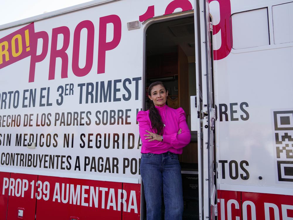 Mayra Rodriguez of Moms for Arizona uses an RV to raise awareness of Arizona's Prop 139.