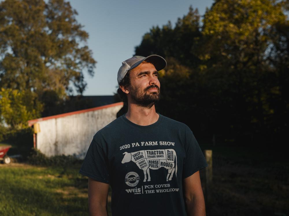 Abram Mellinger, 35, stands for a portrait at the farm in Ronks, PA, on Friday, October 18, 2024.