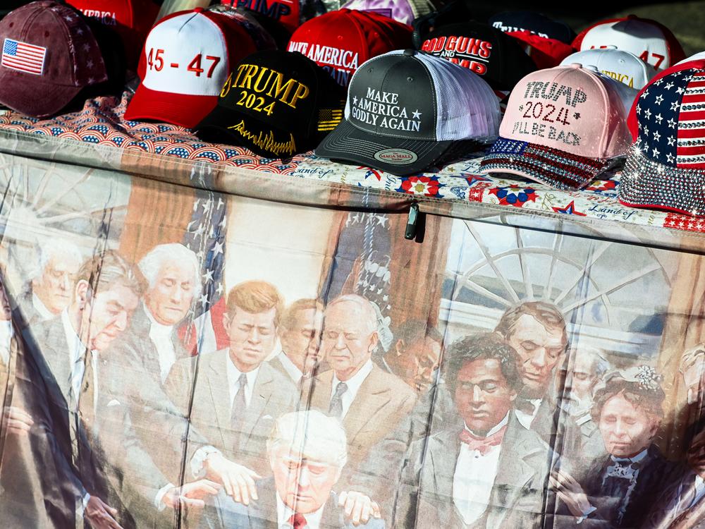 Hats and other merchandise are on sale outside a rally for former President Donald Trump at Dream City Church in Phoenix on June 6.