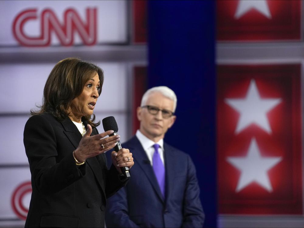 Vice President Harris speaks during a CNN town hall in Aston, Pa., on Wednesday as moderator Anderson Cooper listens in.