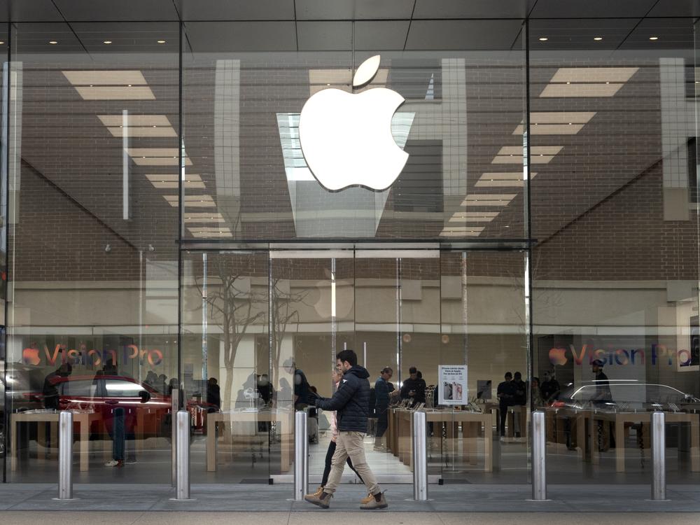 The Consumer Finance Protection Bureau has fined Apple and Goldman Sachs $89 million. Pictured is the Apple logo hanging in front of an Apple store in Chicago in March.
