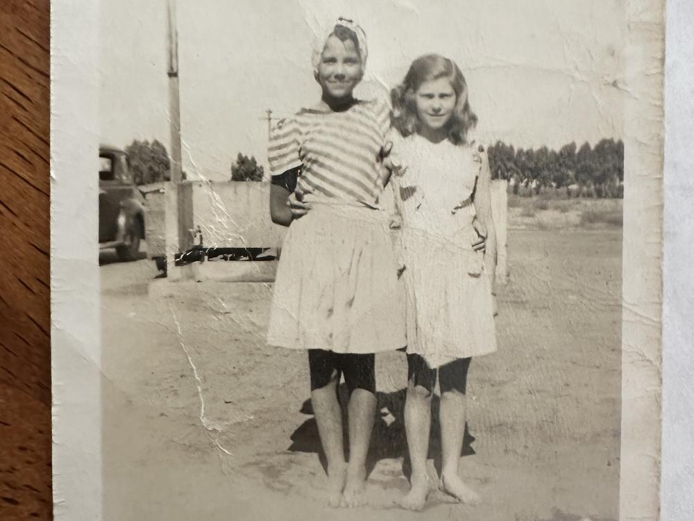 Pat Rush (right) with a friend in the government camp outside Bakersfield, California.