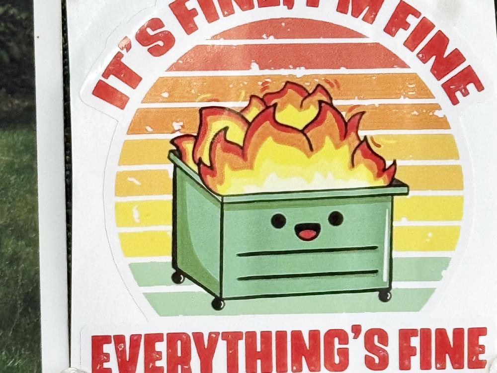 Yancey County elections director Mary Beth Tipton's office sports a sticker of a smiling cartoon dumpster that says, 