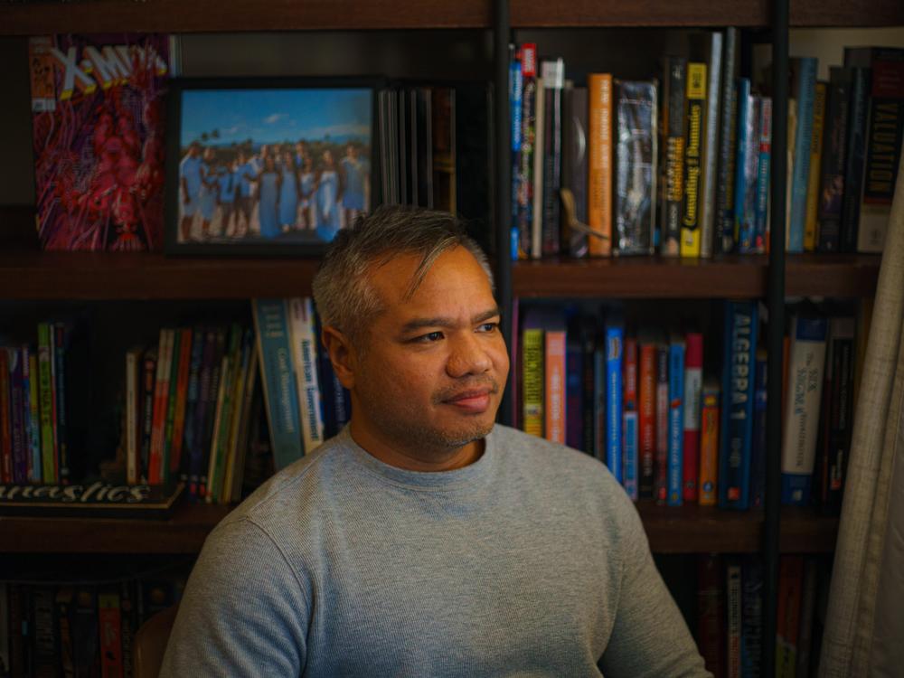 Tha Vin sits in his home office while reflecting on this year's election. Preserving democracy is one of the issues motivating him, he said.